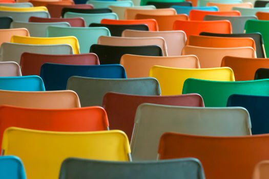 A colorful array of chairs in a classroom setting. Perfect for educational or design concepts.